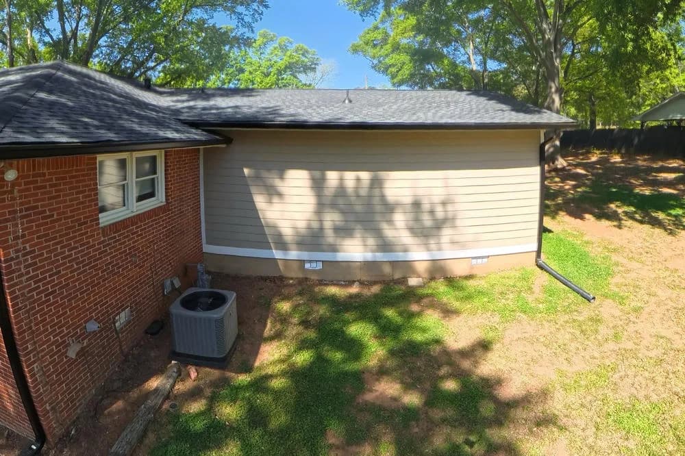 Rear elevation of a home with asphalt roofing and siding