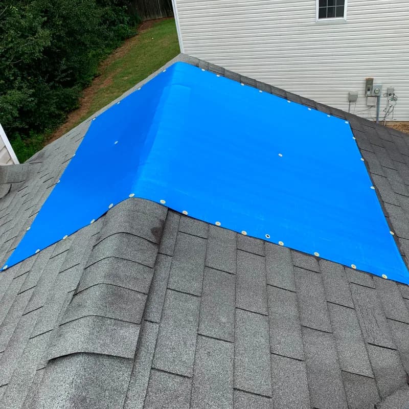 Archived roof repair photograph published for Roswell