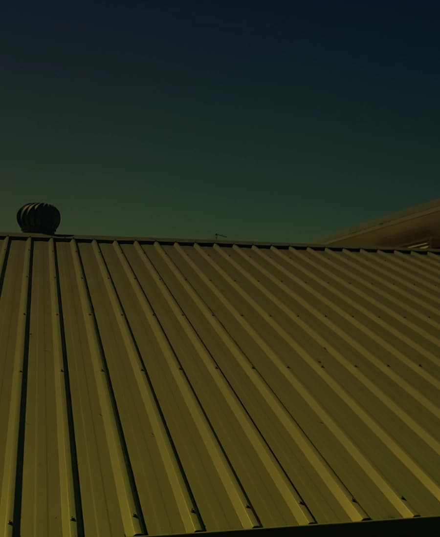 Exposed-fastener ribbed metal roof panels