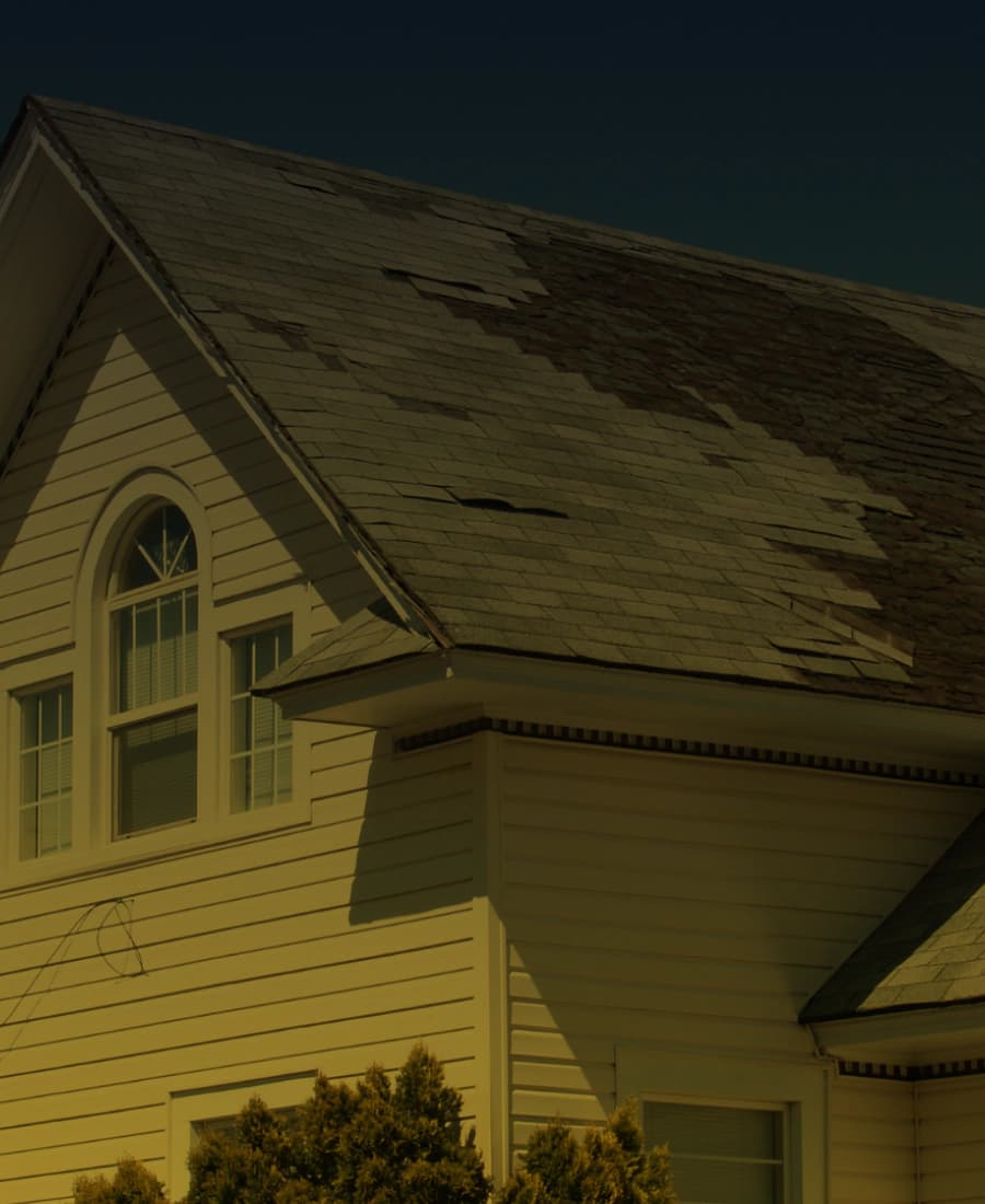 Worn shingle roof on a residential dormer