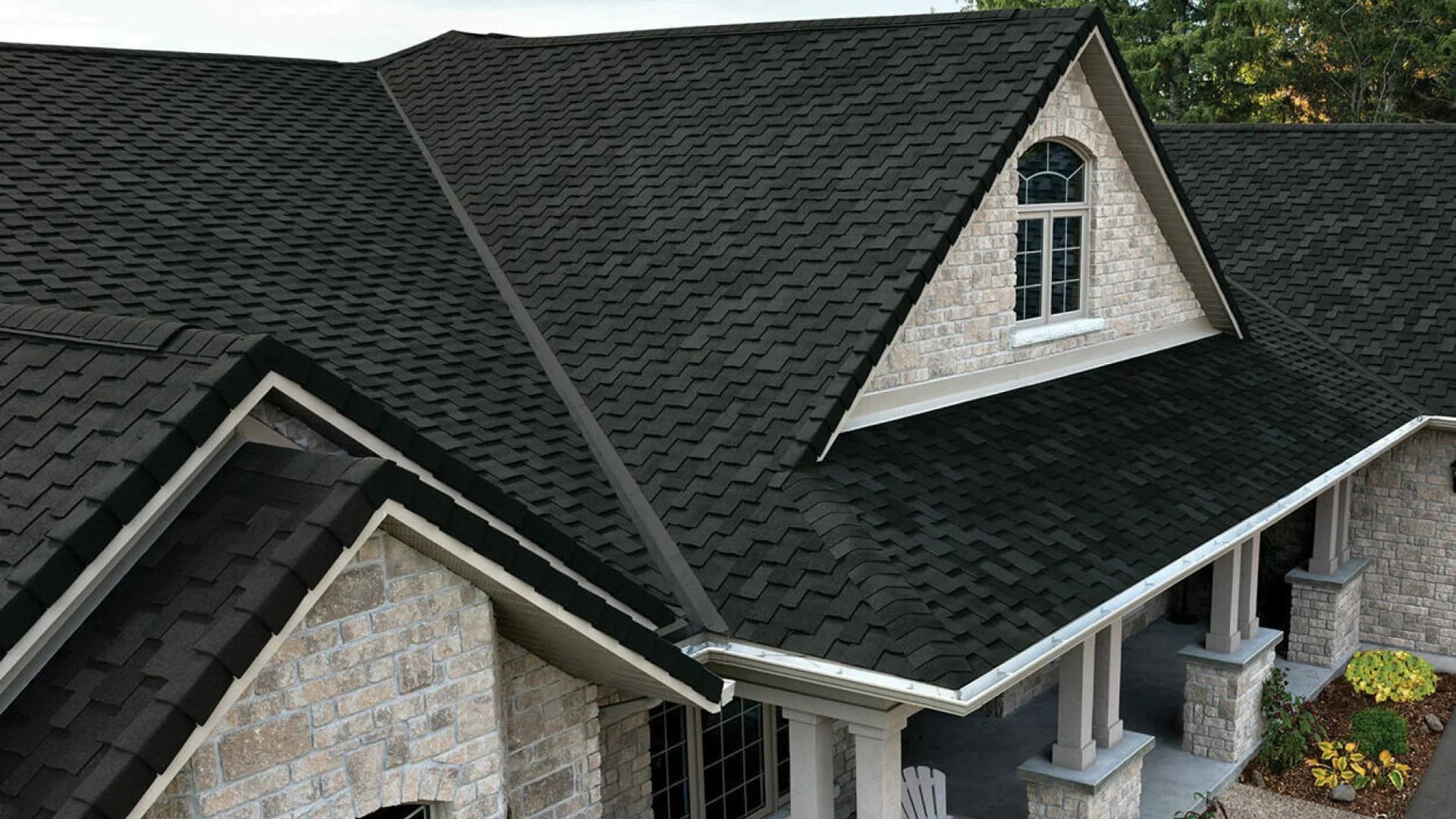 Completed dark shingle roof on a residential property