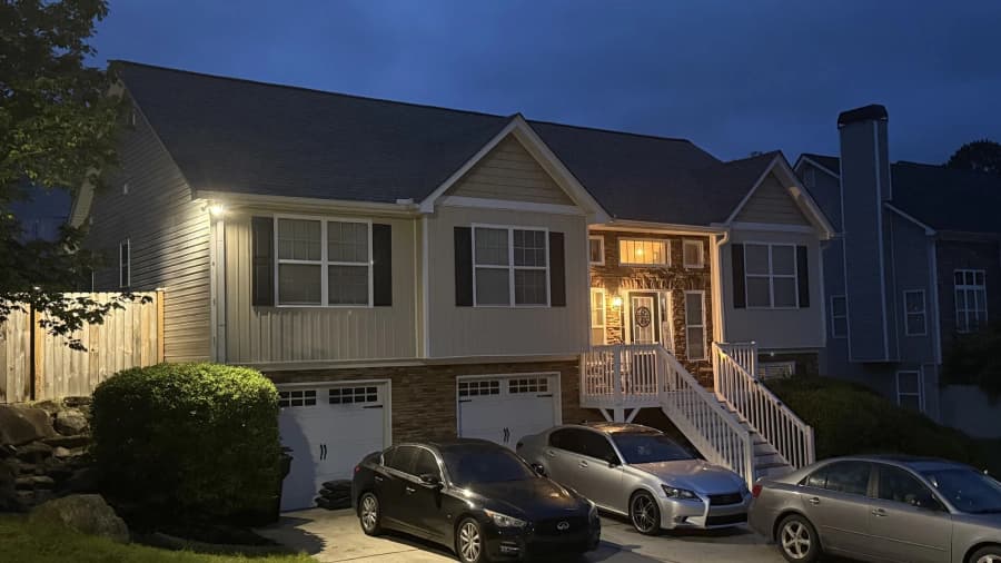 Completed residential roof photographed in the evening