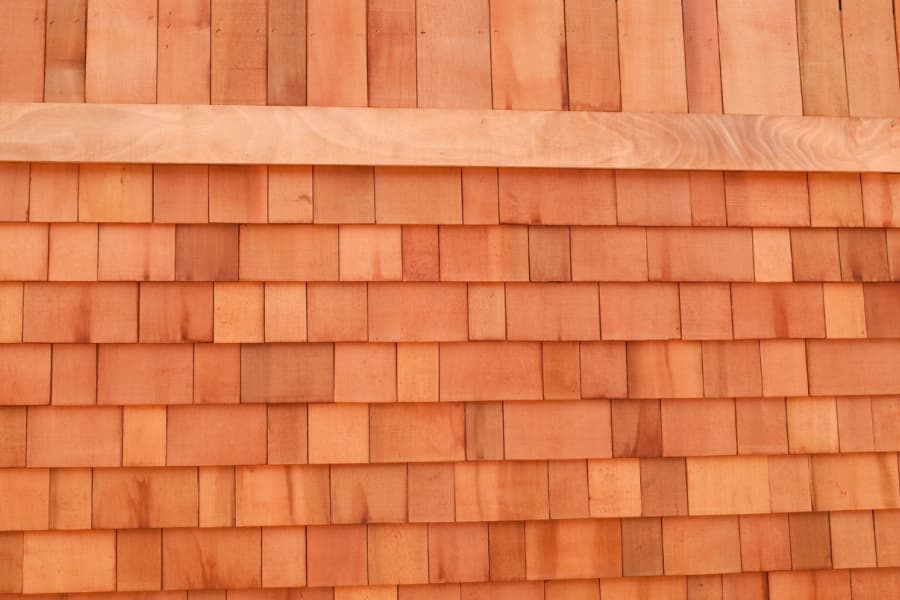 Natural cedar shake siding arranged in even courses