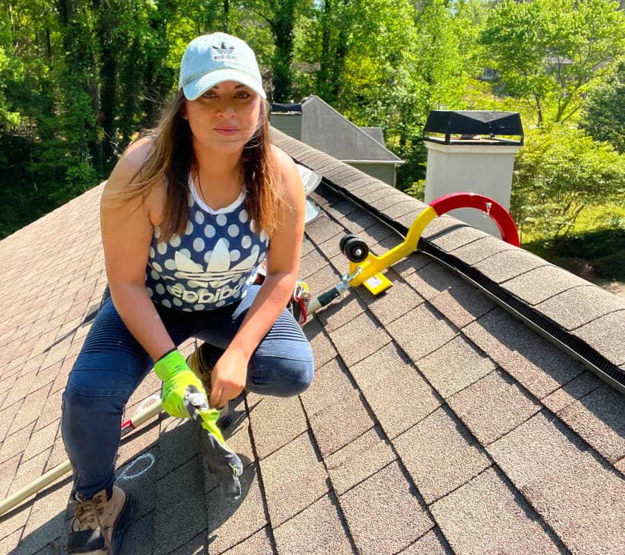 ProBYLT team member standing on a roof